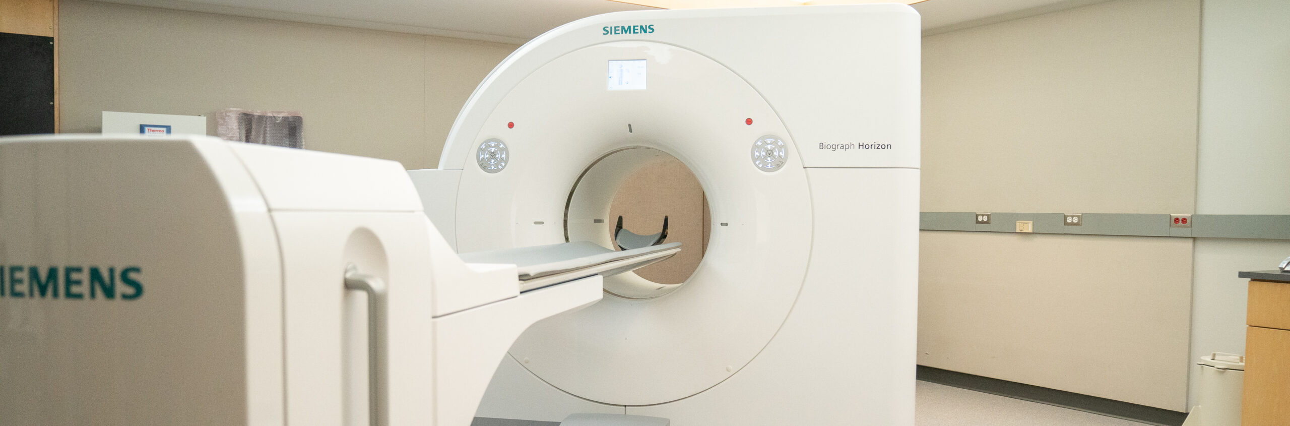 A photo of a Siemens PET scan machine used for research visits